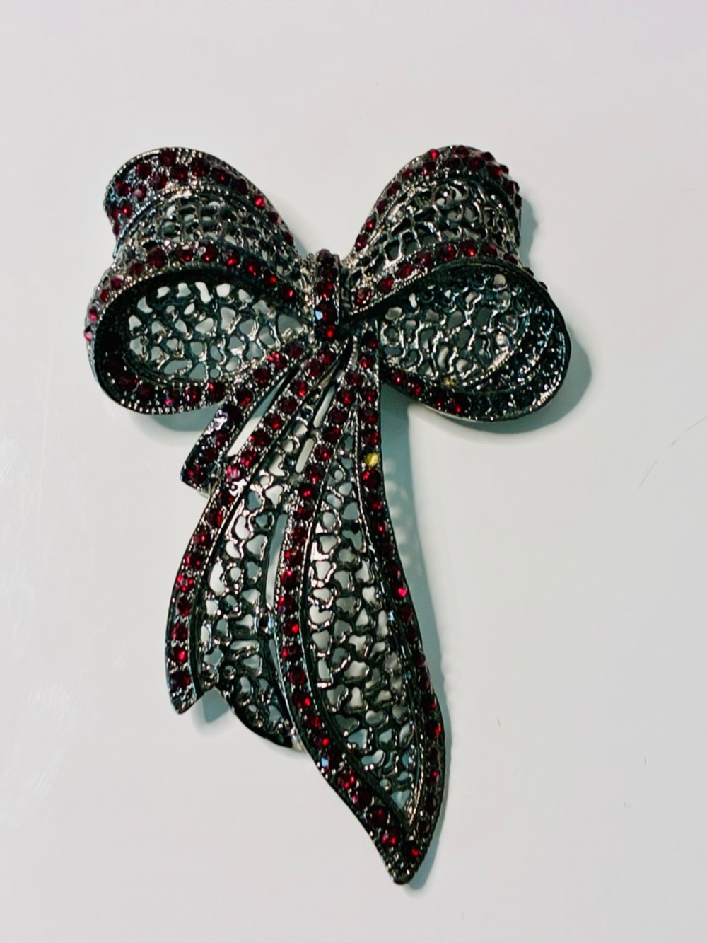 Source Unknown Black Filigree Bow Brooch with Red Stones